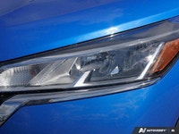 Navigate city streets with confidence and style in the 2022 Nissan Kicks S, striking in Electric Blu... (image 9)