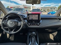 This 2023 Toyota Corolla Hybrid LE sedan offers impressive fuel efficiency and a surprisingly spacio... (image 8)