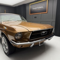 Check out this 1967 Ford Mustang Fastback. This is a gorgeous car. The gold paint is incredible and... (image 5)