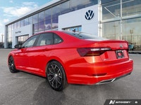 The 2019 Volkswagen Jetta Highline, presented in eye-catching Habanero Orange Metallic with a sophis... (image 2)