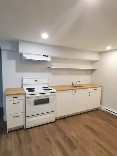 Nestled in the pine trees Welcome home to this inviting main-floor, two-bedroom, one-bath apartment...