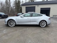 Experience the exceptional performance of the 2015 Tesla Model S P85D, a stunning silver AWD sedan r... (image 1)
