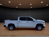 The 2023 Chevrolet Silverado 1500 Crew Cab Short Box 4-Wheel Drive Work Truck, in crisp white with a... (image 4)