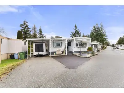Welcome to Langley Grove Estates! Beautiful Custom Double Wide beautifully updated home featuring ov...