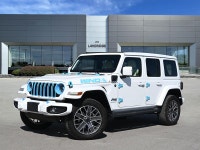 The 2024 Jeep Wrangler 4xe High Altitude 4 Door blends open-air freedom with plug-in hybrid power in... (image 2)