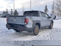 Our 2023 Honda Ridgeline Touring in Sonic Grey with the Honda Performance Development Package is in... (image 9)