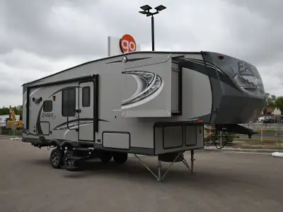 The 2013 Eagle 26.5RKS is a well-designed fifth wheel featuring a spacious rear kitchen layout with...