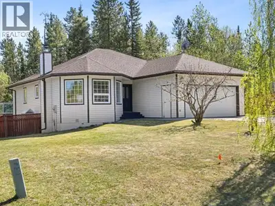 Curb appeal abounds at 34 Thompson Road, where a manicured lawn, graceful weeping birch, mature lila...