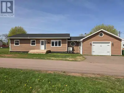 Here is a 3 bedroom bungalow with an attached garage sitting on over a half acre lot on an almost pr...