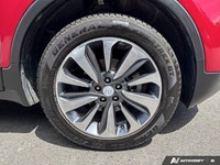 The 2020 Buick Encore Essence, dazzling in Winterberry Red Metallic with a sophisticated Ebony leath... (image 8)
