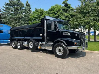 NEW VOLVO VHD84B dump truck in Black with matching Bibeau 21' x 48'' x 60'' black dump body. Protect...
