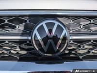 The 2024 Volkswagen Taos Highline, finished in a pristine white, comes equipped with an all-wheel-dr... (image 9)