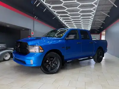 The 2021 Ram 1500 Classic Express 4x4 Crew Cab in a striking Blue finish is a true powerhouse with i...