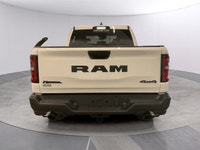 The 2026 Ram 1500 Rebel 4x4 Crew Cab 57 Box is ready to impress with its striking white finish and r... (image 3)