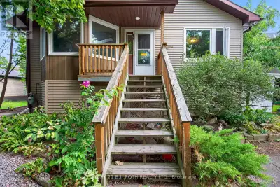 Set on an expansive 80' x 264' (approx. half-acre) lot, this raised bungalow presents exciting possi...