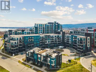 Stylish 1 Bedroom + Den with Partial Lake Views in Sought-After Aquablu! Welcome to one of the lovel...