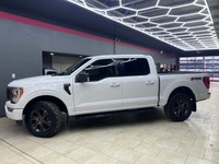 Experience the perfect blend of power and sophistication with the 2022 Ford F-150 XLT, presented in... (image 1)