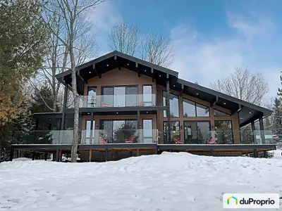 Superbe Chalet au Bord de Lac Luxe Moderne au Coeur de la Nature Évadez-vous dans la sérénité de ce...