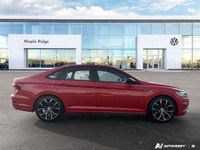The 2019 Volkswagen Jetta Highline, presented in eye-catching Habanero Orange Metallic with a sophis... (image 5)