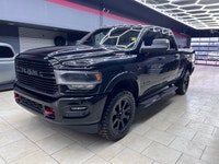 The 2019 Ram 2500 Laramie, with its bold black exterior and sophisticated 4x4 drive, promises except... (image 4)