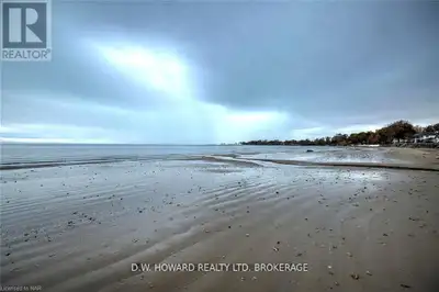 This sandy beach is truly exceptional! Located on MacDonald Drive, this expansive waterfront propert...