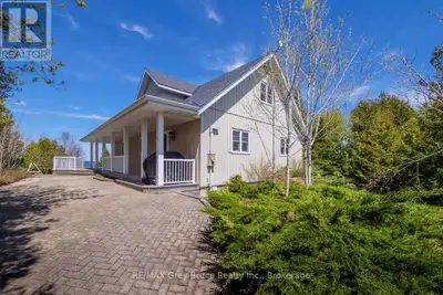Welcome to your dream waterfront property in the heart of Tobermory. Enter the long winding driveway...
