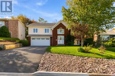 Discover an exceptional executive split-entry in highly sought-after Colby Village, where generous s...