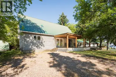 Tucked into the trees at Makwa Lake, this seasonal cabin is one lot back from the water—close enough...