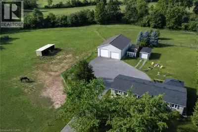 Renovated 3+1 bdrm bungalow W/prof finished in-law suite on 3-acres W/lush pastures & massive 50 X 3...