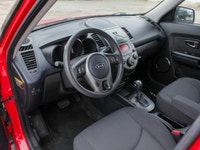 The 2011 Kia Soul 2u in a vibrant red with front-wheel drive is a vehicle built for handling the dem... (image 9)
