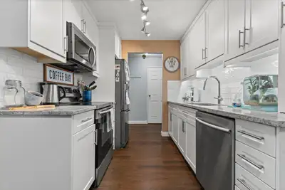 This bright and beautifully updated 2 bed, 1 bath walk-out corner unit is tucked away at the end of...