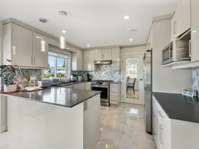 A rare Fleetwood gem offering two brand-new bachelor suites- perfect for extended family, in-laws, o...