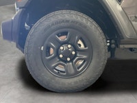 Get ready to command attention with the 2026 Jeep Wrangler Sport, a true symbol of adventure and rug... (image 8)
