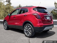 The 2020 Buick Encore Essence, dazzling in Winterberry Red Metallic with a sophisticated Ebony leath... (image 2)