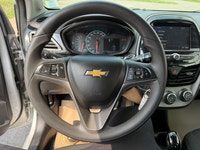 A compact and efficient hatchback with modern convenience features, easy maneuverability, and city-f... (image 9)