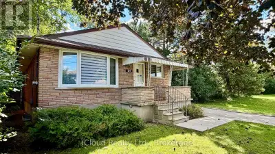 Welcome to your private sanctuary in central Kitchener! Nestled on a rare, tree-lined ravine lot wit...