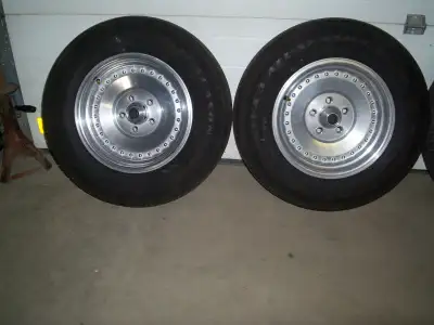 Set of 4 Centerline Style Wheels and tires. Rears are 275/60/15 BFG Radial T/A Fronts are 215/70/15....