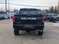 The 2026 Ram 2500 Laramie Mega Cab in Diamond Black Crystal Pearl combines heavy-duty capability wit... (image 4)