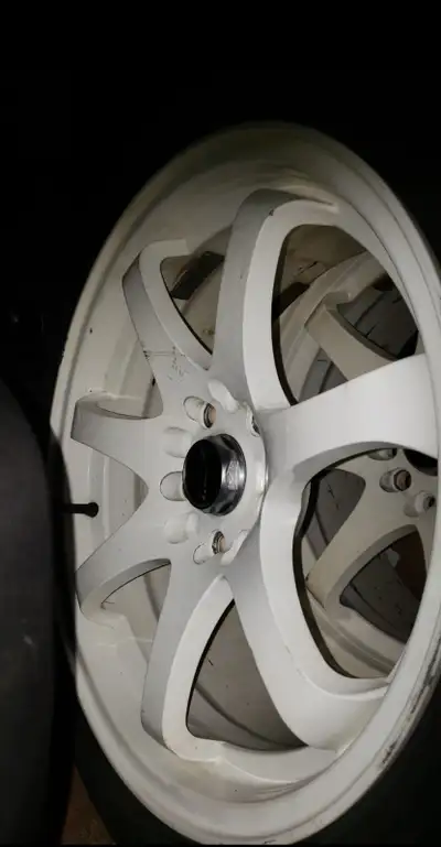 Nice 4 set of 17 inch universal rims wit 3 decent tires recently powder coated in great condition $5...