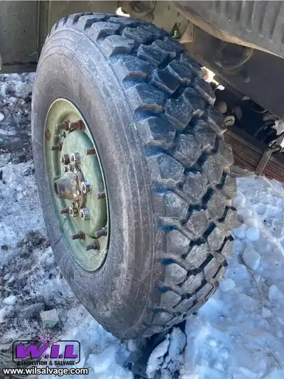 This 11.00R20 Michelin assembly includes both thetire AND the rim, sourced directly from 1980 Canadi...