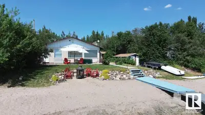 Welcome to 61 Argentia Beach! With 75 ft. of sandy beachfront and a fully serviced lot, this charmin...