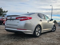 Experience the elegant blend of style and efficiency with the 2012 Kia Optima Hybrid, finished in a... (image 2)