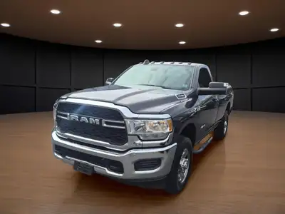 Meet the 2022 Ram 3500 Tradesman in an attractive brown hue with a robust 4x4 drivetrain, built to h...