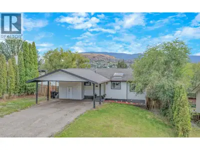 FRESHLY UPDATED & READY FOR A NEW CHAPTER! Welcome to this inviting four-bedroom plus den, two-bathr...