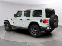Experience the rugged charm of the new 2026 Jeep Wrangler Sahara 4 Door 4x4 in a striking white fini... (image 2)