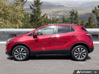 The 2020 Buick Encore Essence, dazzling in Winterberry Red Metallic with a sophisticated Ebony leath... (image 1)