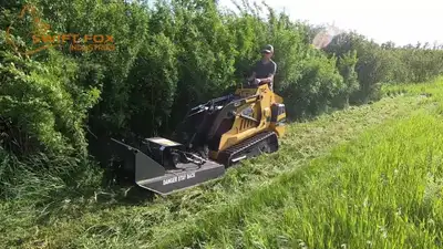 Tackle tight places and rough ground with your mini skid steer brush cutter. Cut up to 3” brush with...