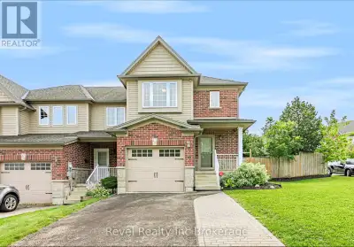 Welcome to 420 Sales Drive, Woodstock a beautifully refreshed end unit freehold townhouse offering e...