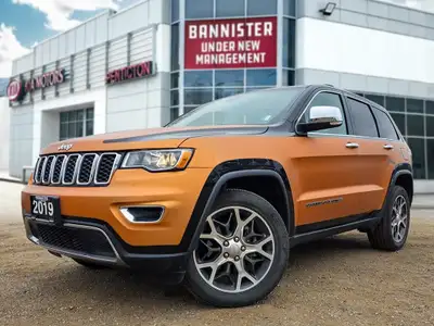 Introducing the stunning 2019 Jeep Grand Cherokee Limited 4x4, a vibrant orange SUV that promises an...