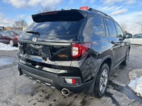 Conquer every adventure with the rugged yet refined 2023 Honda Passport TrailSport, a vehicle engine... (image 4)